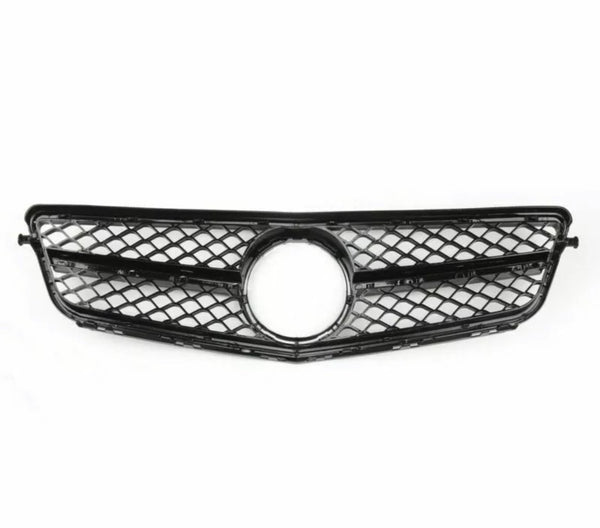 A black car grille with a diamond mesh pattern and a central circular emblem space lies flat against a plain white background.