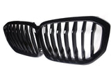 A black grille with vertical slats is positioned side-by-side, designed for a vehicle's front. It is set against a plain white background, emphasizing its shiny finish.