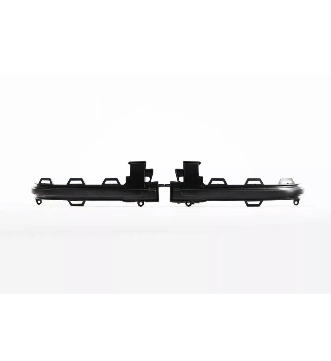 Two black plastic automotive grille inserts are aligned horizontally against a plain white background, featuring multiple tab connections for attachment.