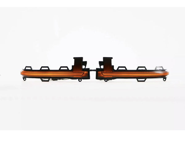 Two orange LED light strips are aligned side by side with black mounting brackets, set against a plain white background.