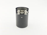 A cylindrical carbon-fiber exhaust tip featuring a metallic clamp, resting upright on a plain white background.