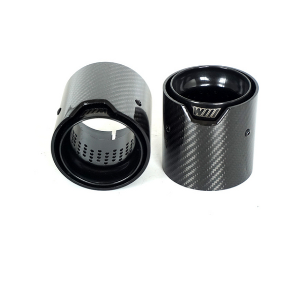 Two cylindrical carbon fiber exhaust tips are displayed against a white background. One is upright, showing a glossy interior and engraved "WILL," while the other lies on its side.