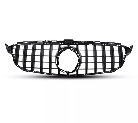 A black car grille with vertical and horizontal slats is positioned against a plain white background, featuring a central circular emblem space, suggesting automotive design.