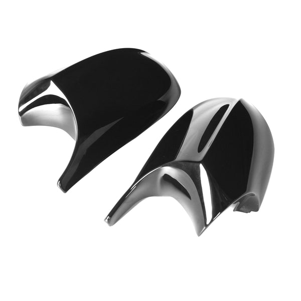 Two glossy, black side view mirror covers for a vehicle are placed on a plain white background, showcasing their sleek, aerodynamic design.