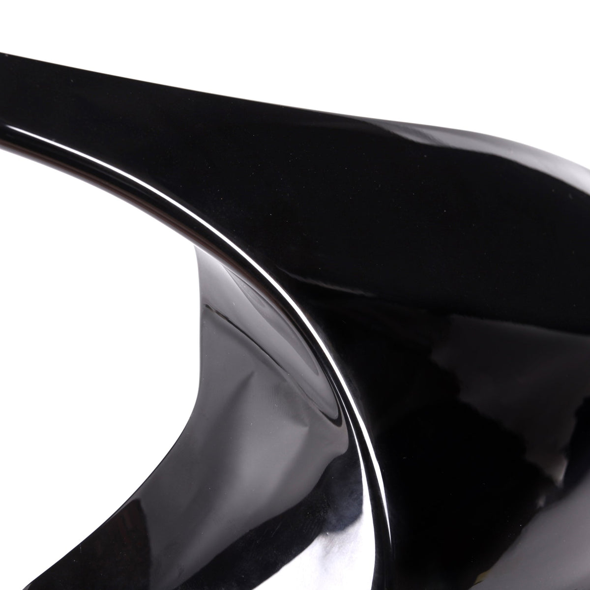 A sleek, shiny black stiletto heel with a pointed tip stands isolated against a plain white background.