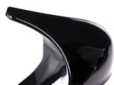 A glossy black high-heeled shoe with a dramatic curved arch stands against a plain white background, highlighting its sleek, artistic design.