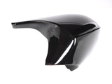 A glossy black motorcycle fairing sits on a white background, showcasing its smooth, aerodynamic curves and reflective surface.