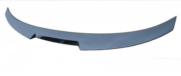 A glossy, curved black car spoiler, smoothly finishes in pointed edges, placed against a white background.
