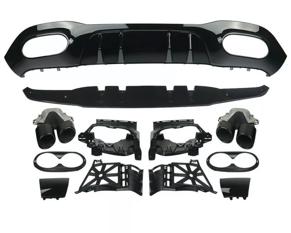 Car parts are laid out for assembly, including a black bumper diffuser, exhaust tips, and various mounting brackets. The components are organized neatly on a plain white background.