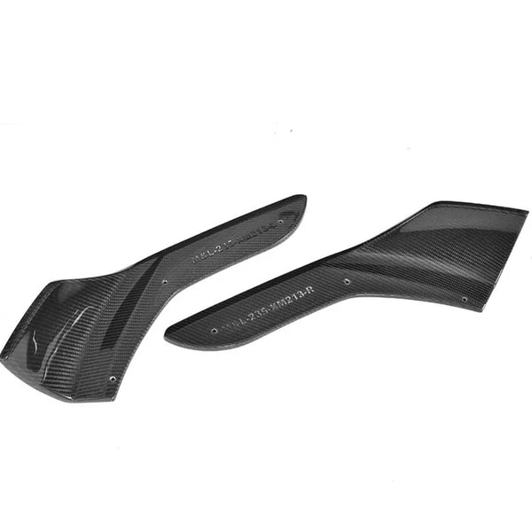 Two carbon fiber car parts lie side by side, textured with a glossy finish, against a plain white background. Visible text reads "ALS.2.45.PN23.4.R" on each piece.