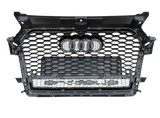 A black hexagonal-patterned car grille displays four rings at the center, set against a gray, seamless background.