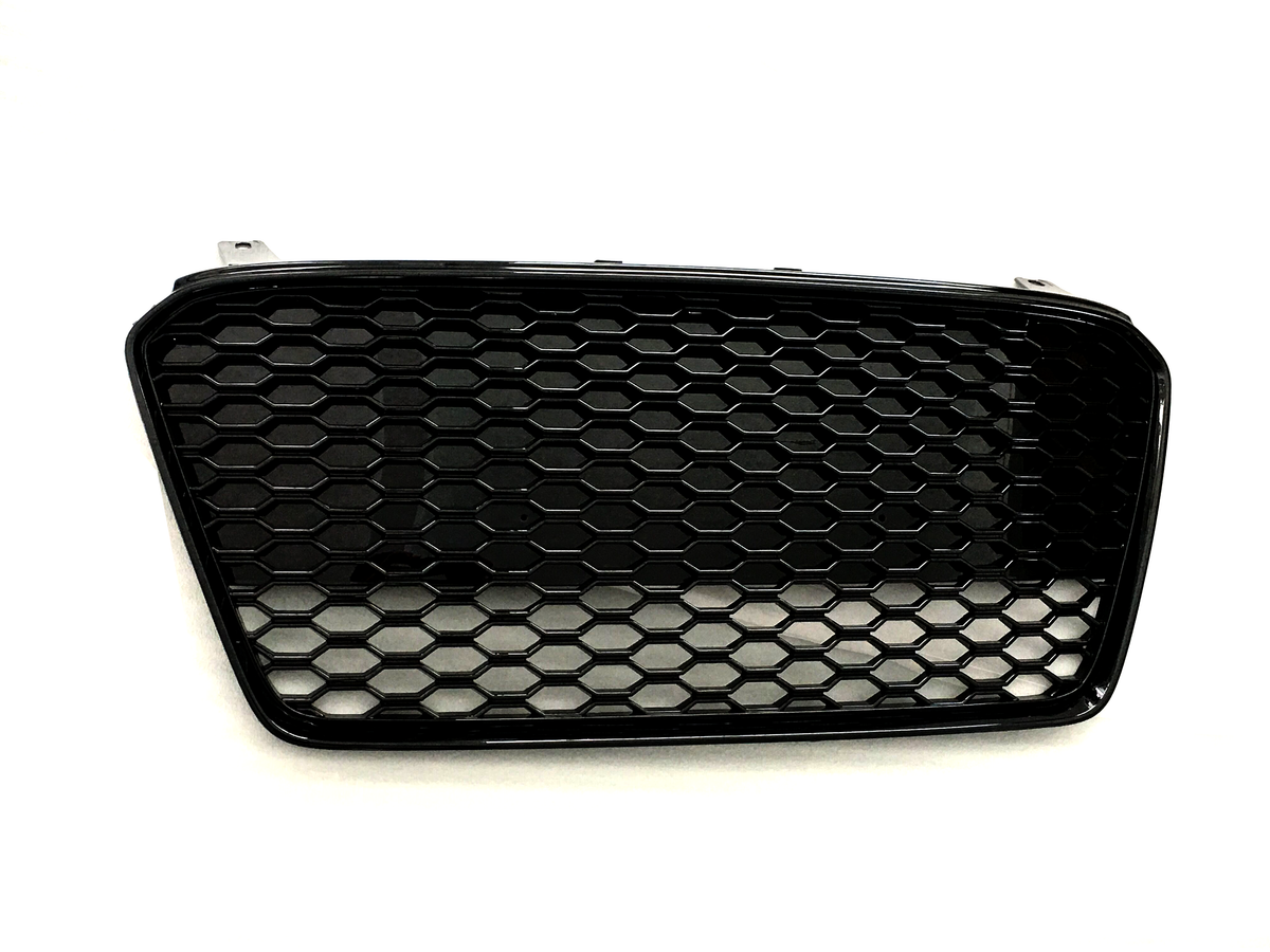 A black honeycomb-patterned car grille lies flat against a plain white background, showcasing its hexagonal mesh design and curved rectangular shape.