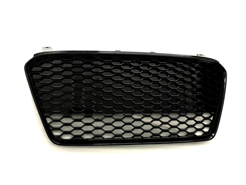 A black honeycomb-patterned car grille lies flat against a plain white background, showcasing its hexagonal mesh design and curved rectangular shape.
