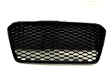 A black car grille with a honeycomb pattern sits against a plain white background.