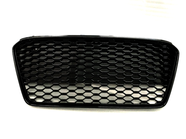 A black car grille with a honeycomb pattern sits against a plain white background.