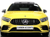 A bright yellow car with a prominent front grille displays a logo. Text on the front reads 