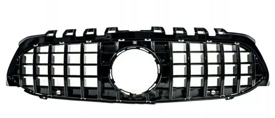 A black car grille with a grid pattern and a central circular opening, shown against a plain white background.