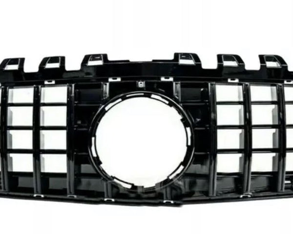 A black car grille with a grid pattern and a central circular opening, shown against a plain white background.