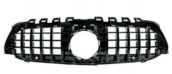 A black car grille with a grid pattern and a central circular opening, shown against a plain white background.